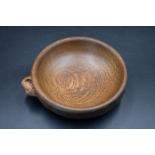 Mouseman - an oak bowl with an adzed exterior finish with a mouse signature, by the workshop of