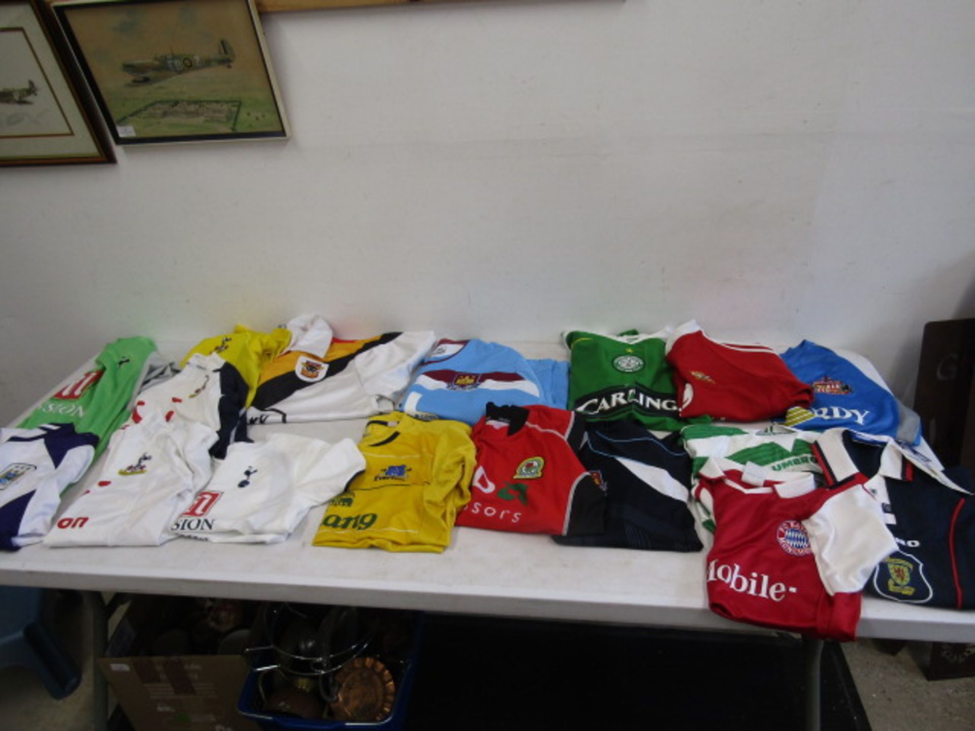 Various football shirts inc Spurs, West Ham, Celtic etc plus a rugby shirt