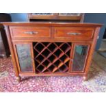 A sideboard with wine rack and glazed cupboards 107cmW 42cmD 84cmH