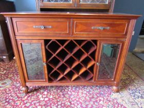 A sideboard with wine rack and glazed cupboards 107cmW 42cmD 84cmH