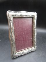 A silver fronted photo frame 12x17cm