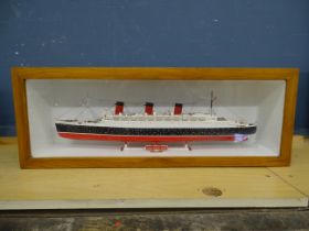 Cased H.M.S. Queen Mary model ship. Case size H23cm W63cm D13cm approx