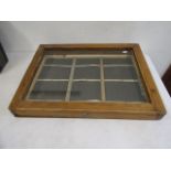 A display case 47cmW 64cmL  7cm at deepest end
