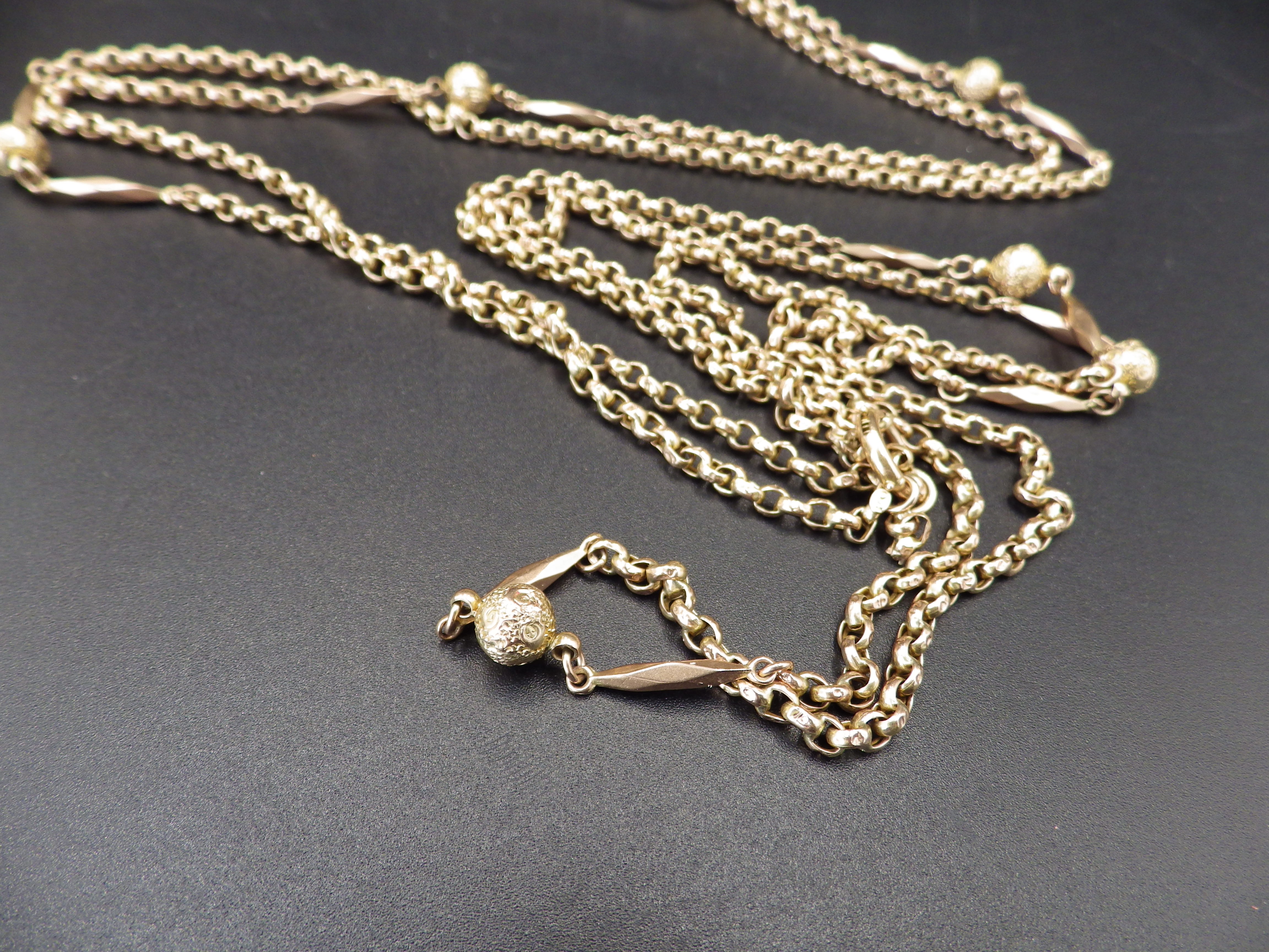 A double lorgnette marked 9 kt, on a gold chain marked 9 ct with decorative sphere detail, the chain - Image 3 of 6