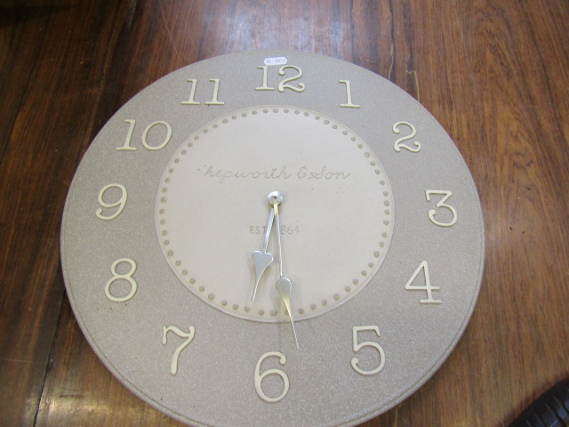 A ceramic wall clock