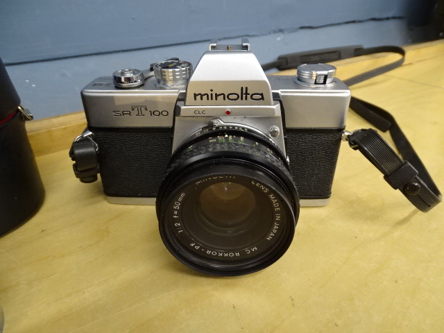Minolta SRT 100 camera with 3 lenses in bag - Image 2 of 7