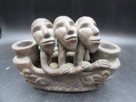 African pottery of 3 men in a boat