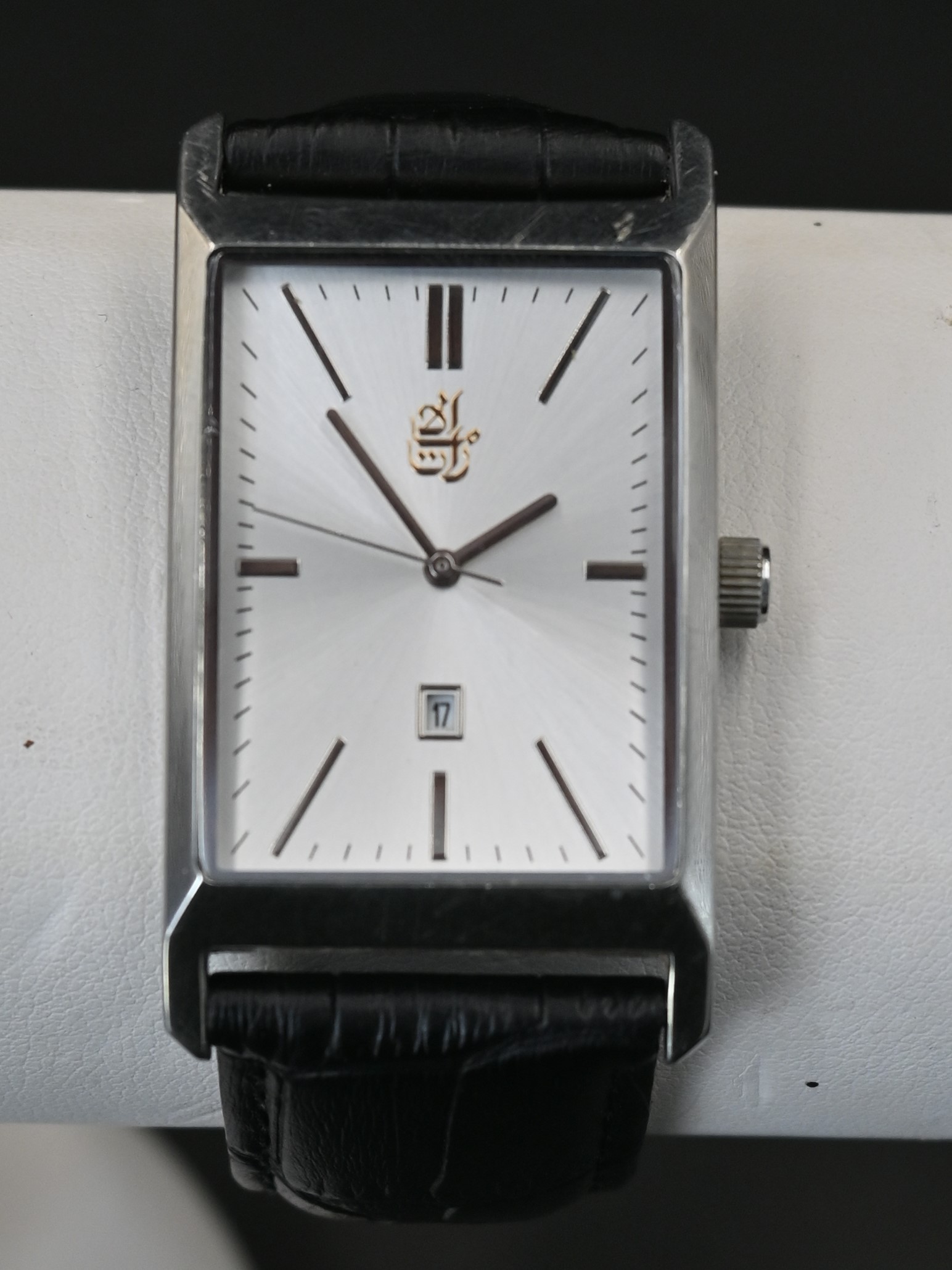 Emirates quartz wristwatch with the Emirate insignia with a silvered face and baton markers date