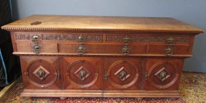 Solid oak carved sideboard with heavy Lion head handles to door fronts and heavy brass drawer