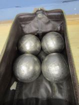 4 Metal boules in bag