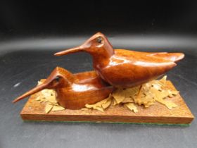 Two carved wood cock on wooden base