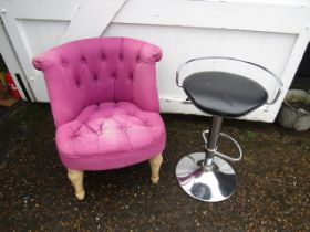 A purple bedroom chair and chrome stool