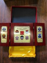 Display of the facial make-up of Chinese Peking Opera in 24k gold finish and enamel detail in wooden