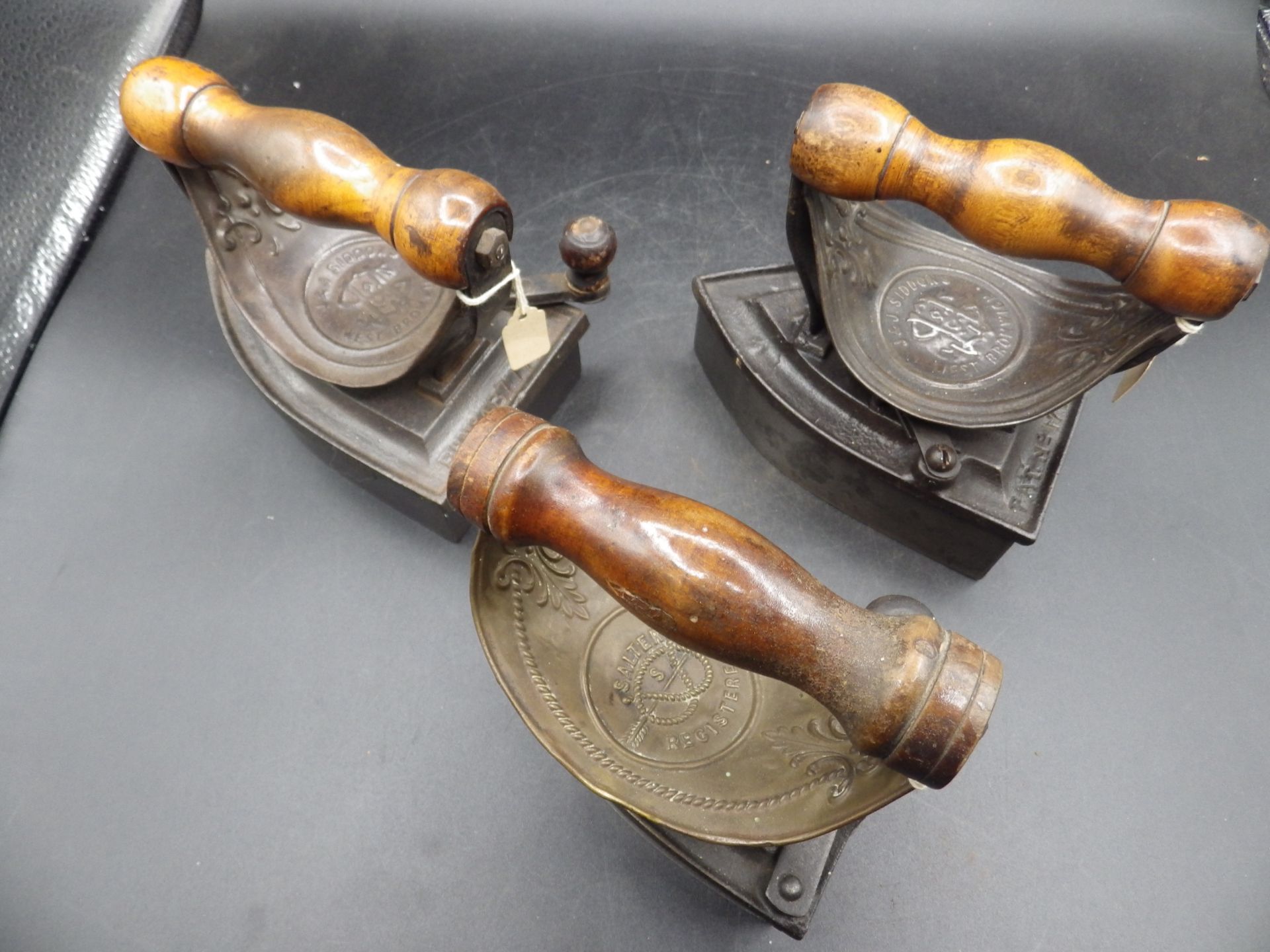 3 box irons with brass? heat shields and wooden handles together with slugs to incl 2x J & J Siddons - Image 6 of 6
