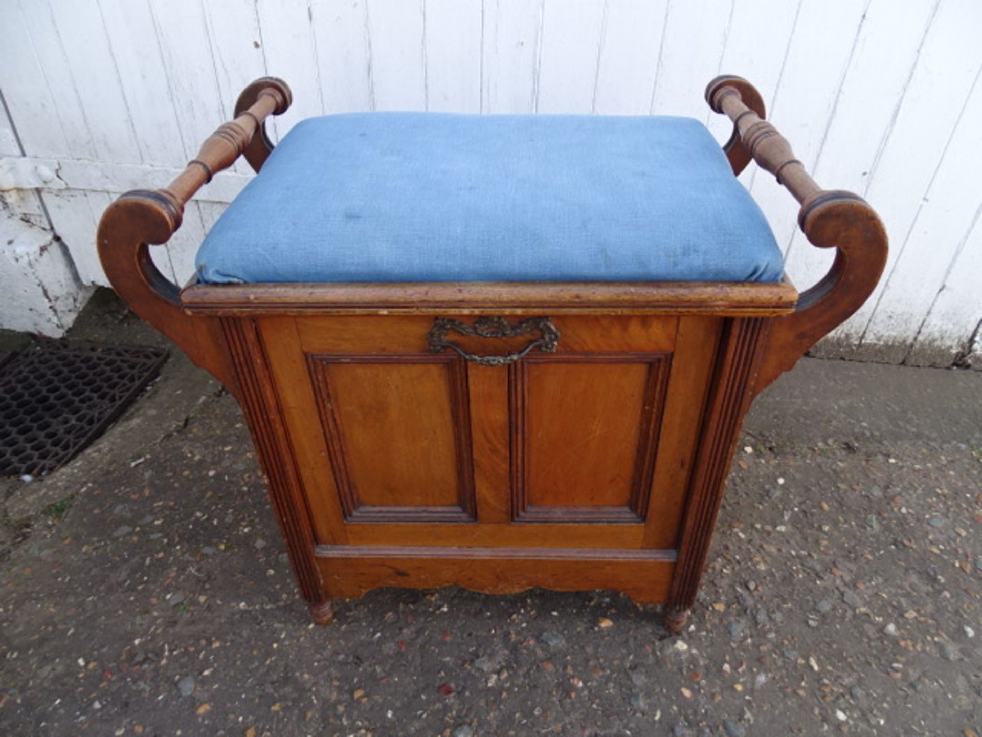 Upholstered piano stool with sheet music storage