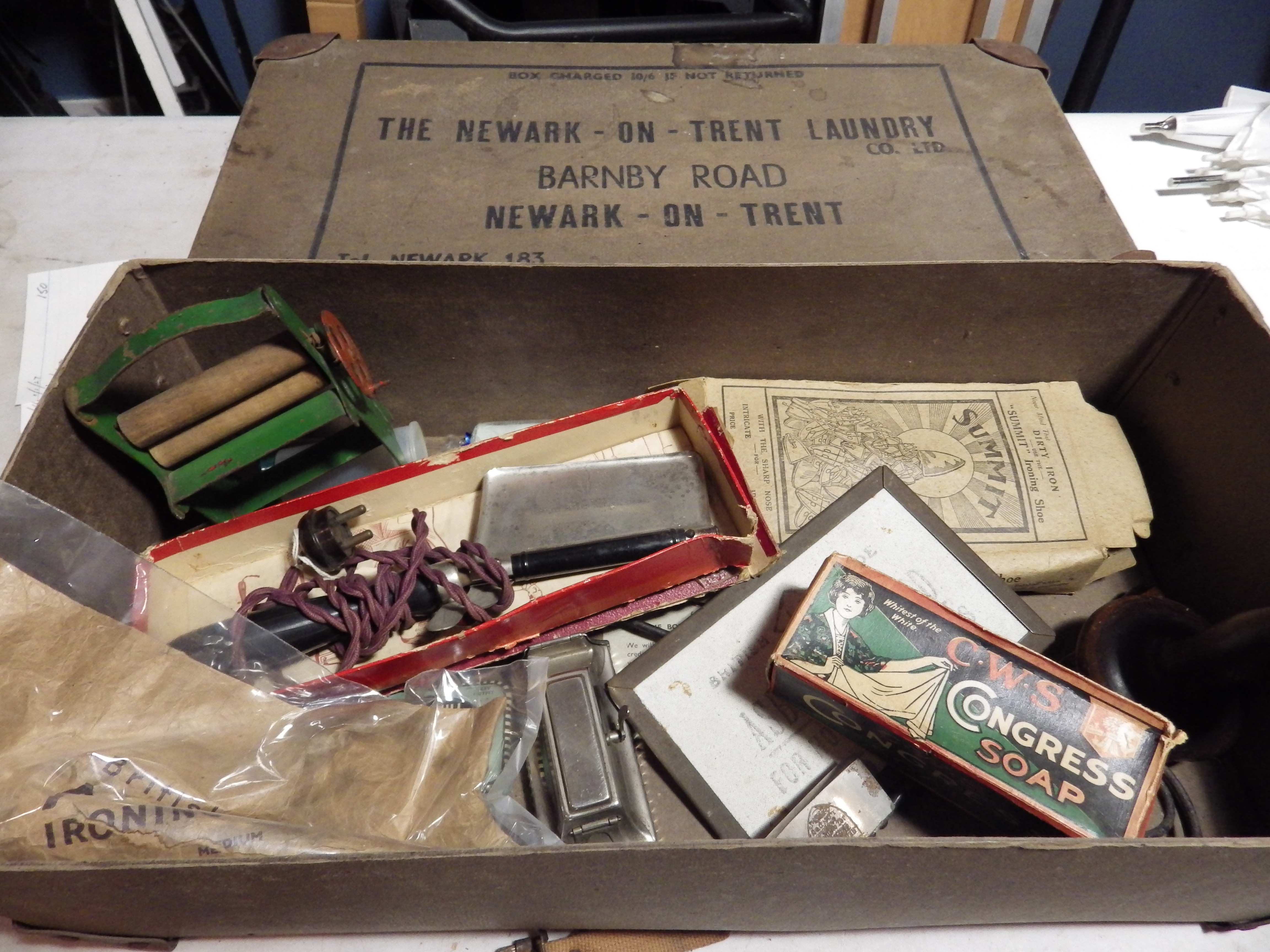 The Newark on Trent Laundry Co ltd box with contents incl Henry Heath gas hatters iron, lignum vitae