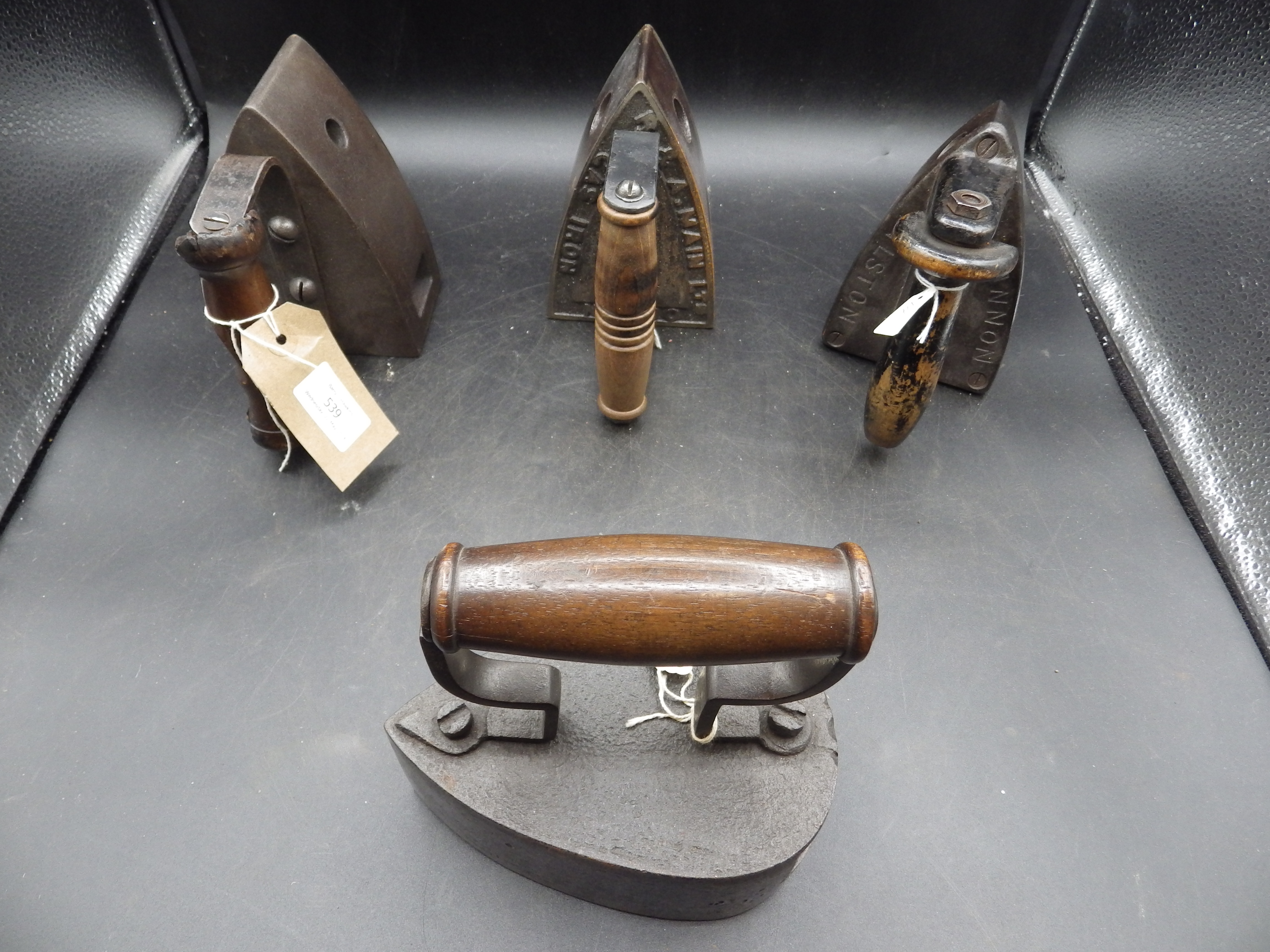 4 assorted gas stove irons to include R & A Main Ltd, Taylor & Wilsons champion, Cannon, etc