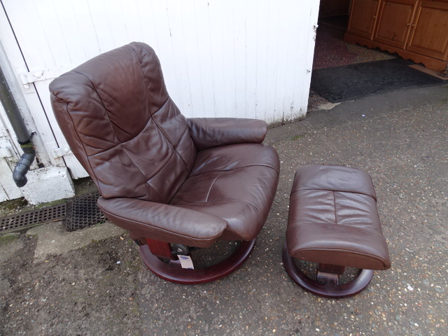 Brown leather Stressless reclining chair with footstool