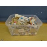 Tub of unsorted used stamps