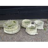 Set of 4 concrete garden planters in the form of sacks. Largest H27cm approx