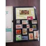 Postage stamps- a sleeved stock book mainly ERII many high value used and mint (a few blocks)