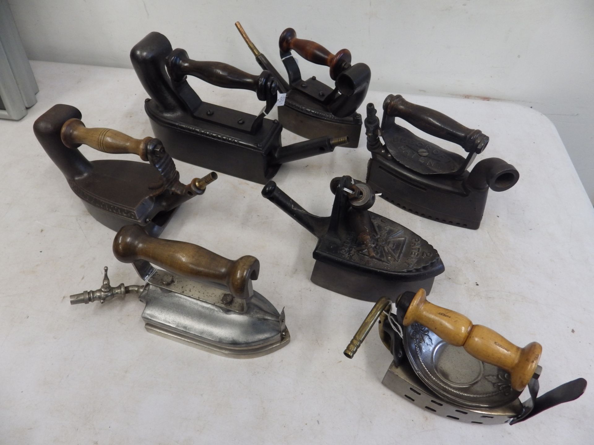 7 assorted gas irons to incl 3x C Wilson & sons Leeds & London gas irons one being a tailors iron,