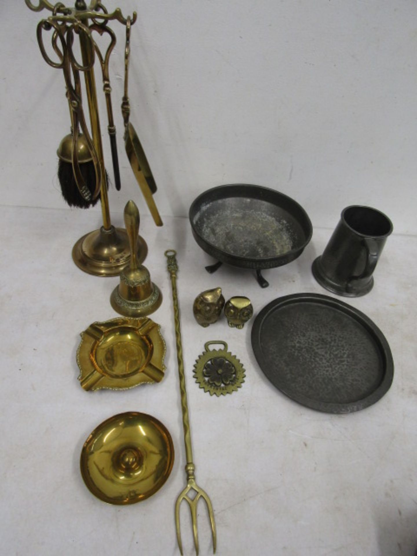 Fire irons, brass ware and pewter tankard, plate and footed dish