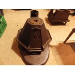 "Tortoise" cast iron stove - octagon shape stove with 6 iron rests, clue chimney and hinged door