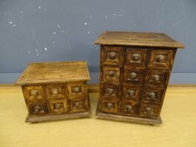 2 Miniature banks of drawers. Largest H30cm W24cm D18cm approx
