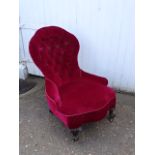 Antique upholstered bedroom chair on brass castors