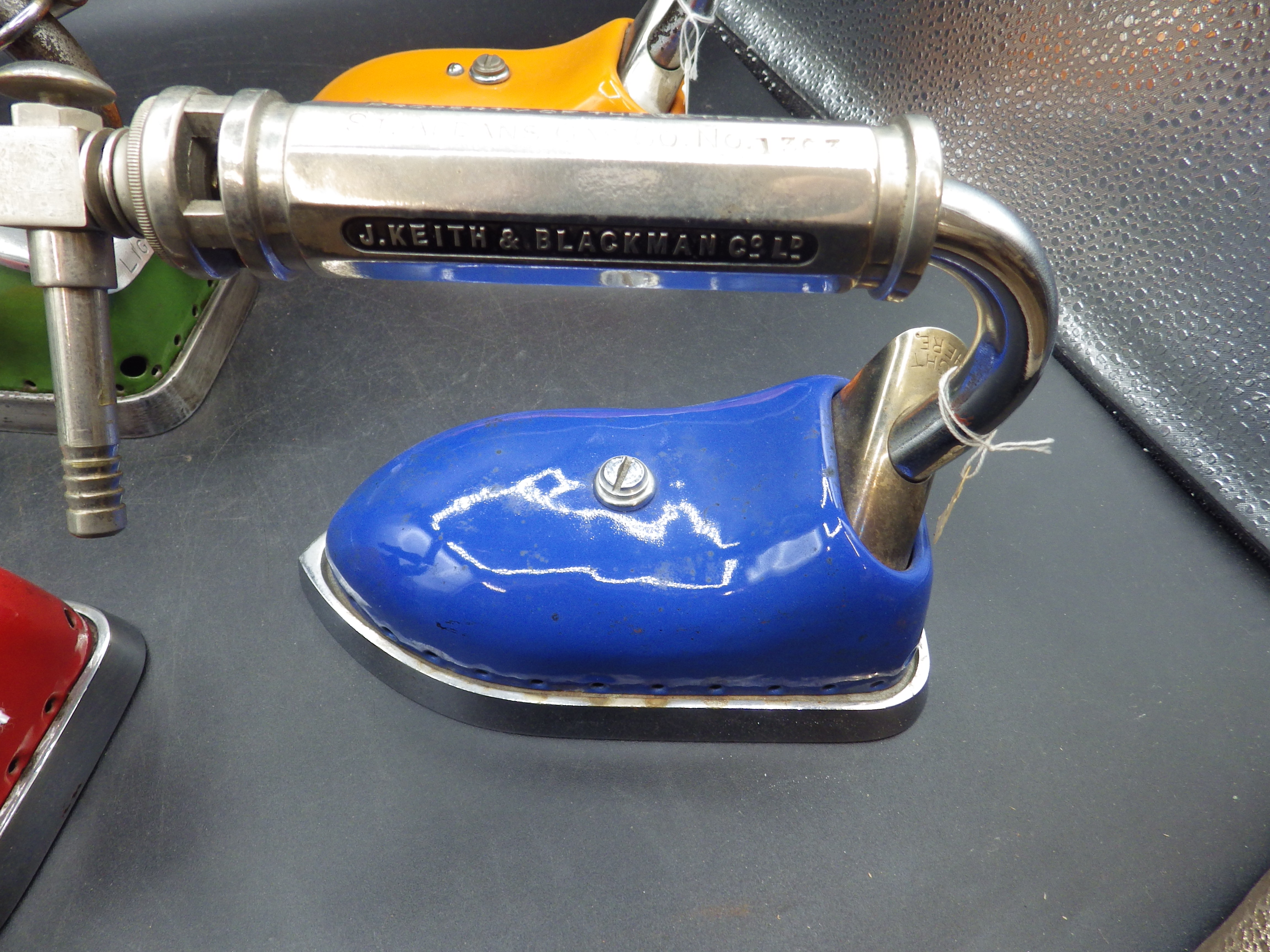 4 J Keith & Blackman Co Ltd patent 360555 coloured enamel irons in red, green, blue and orange - Image 3 of 3