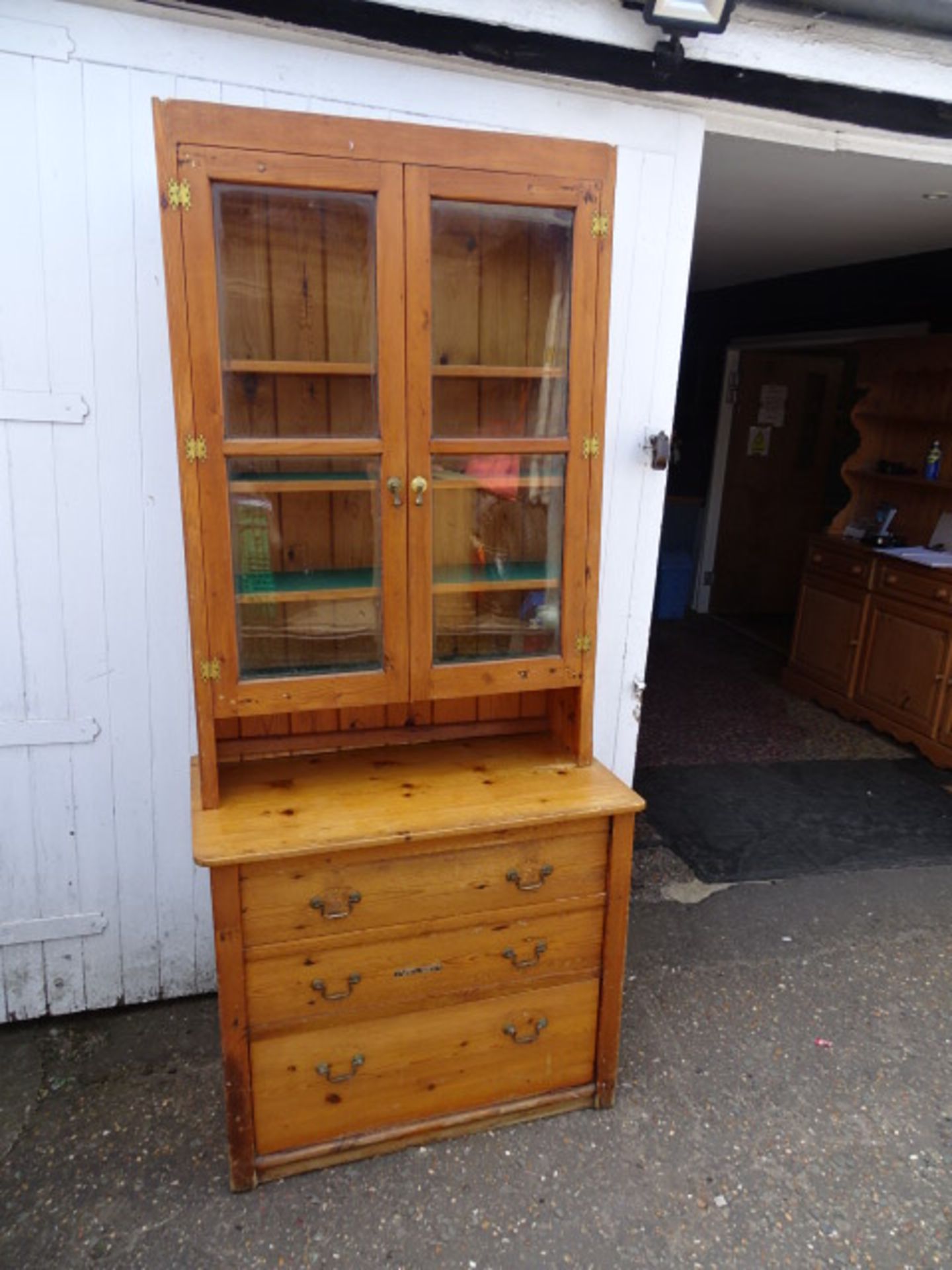 Pine glazed bookcase with drawers to base H204cm W90cm D52cm approx