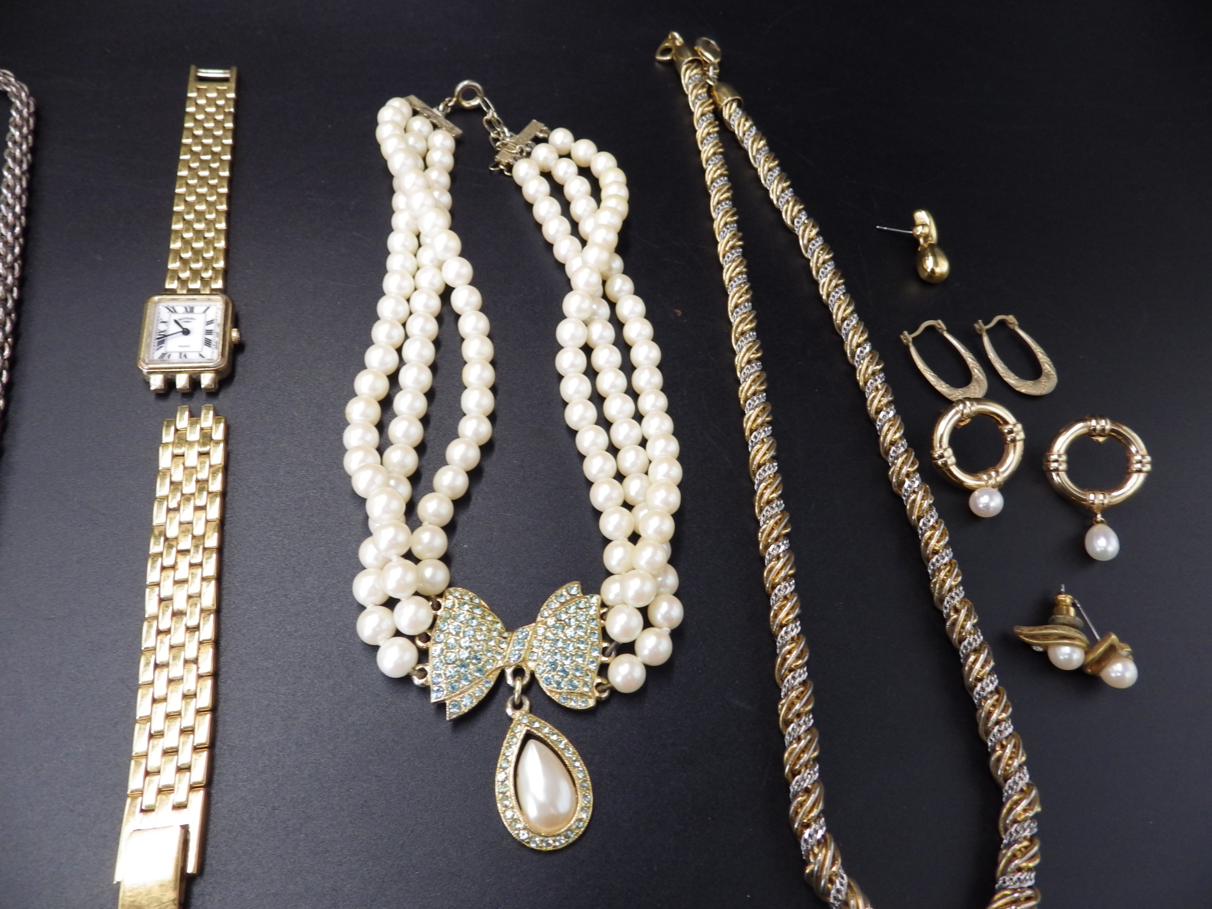 Jewellery lot to include a 925 silver chain, bracelet and hooped earings, a ladies Rotary watch a/