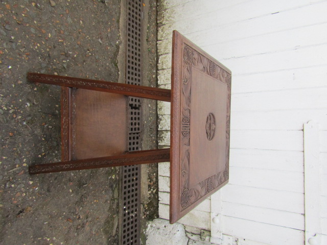 RAF table with carved design