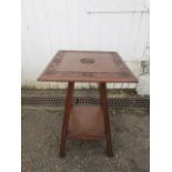RAF table with carved design