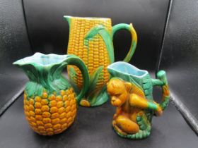 Majolica glazed jugs, one stamped Minton