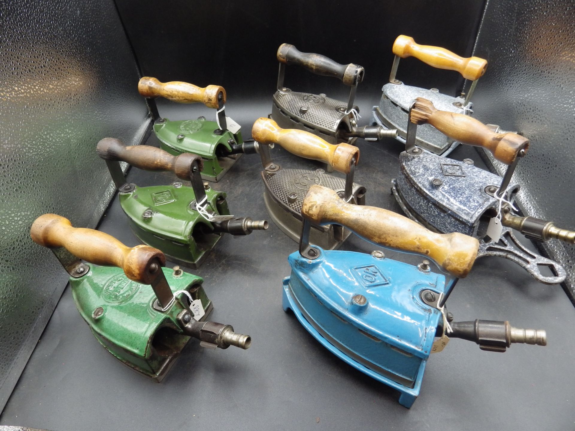 8 assorted OK gas irons etc, 6 enamel, 4 with trivets