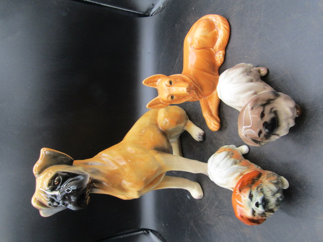 4 dog figurines