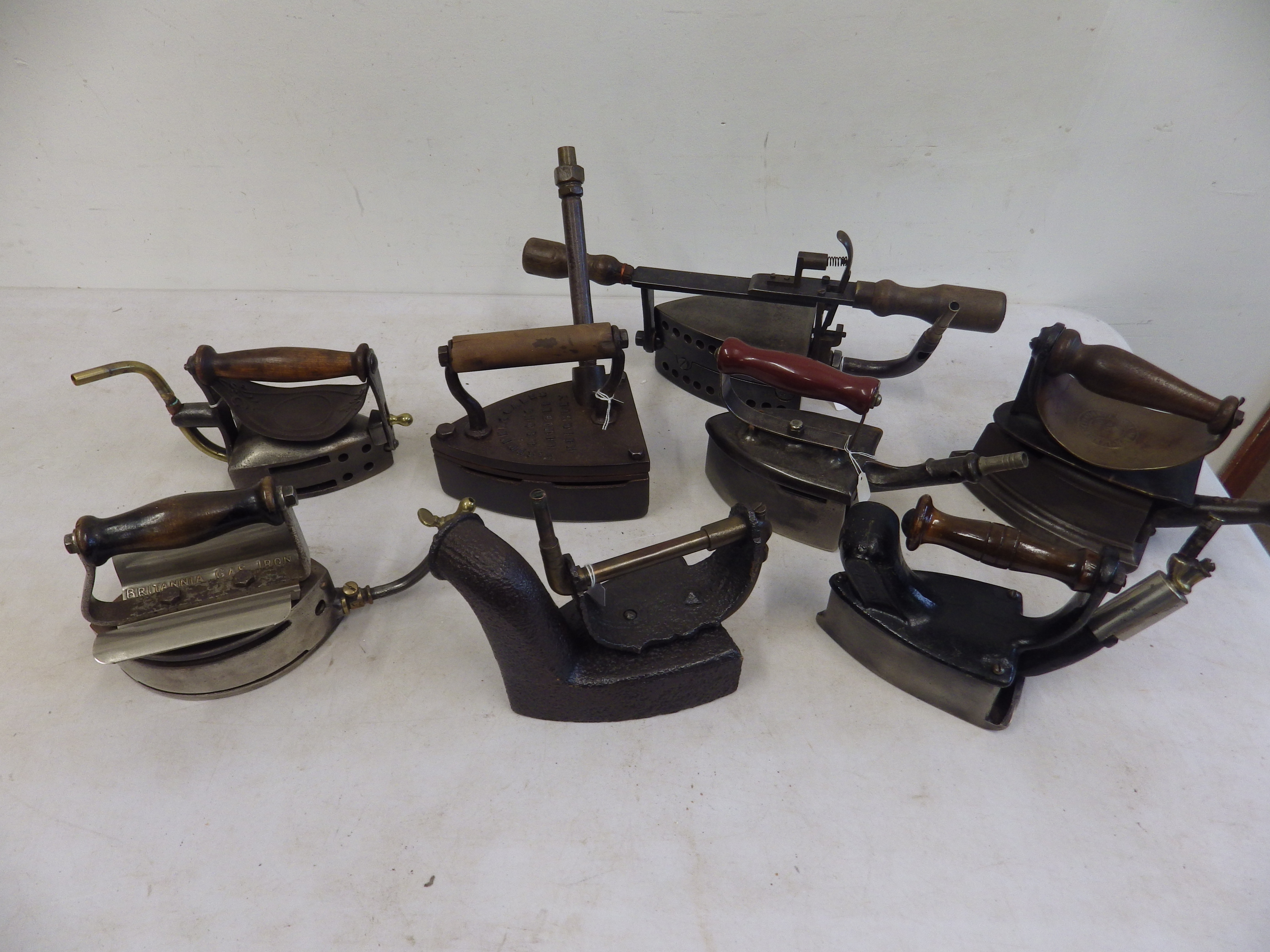 8 assorted gas irons to incl 2 x turn over gas irons, Brittania patent 238701/24, Izot? patent
