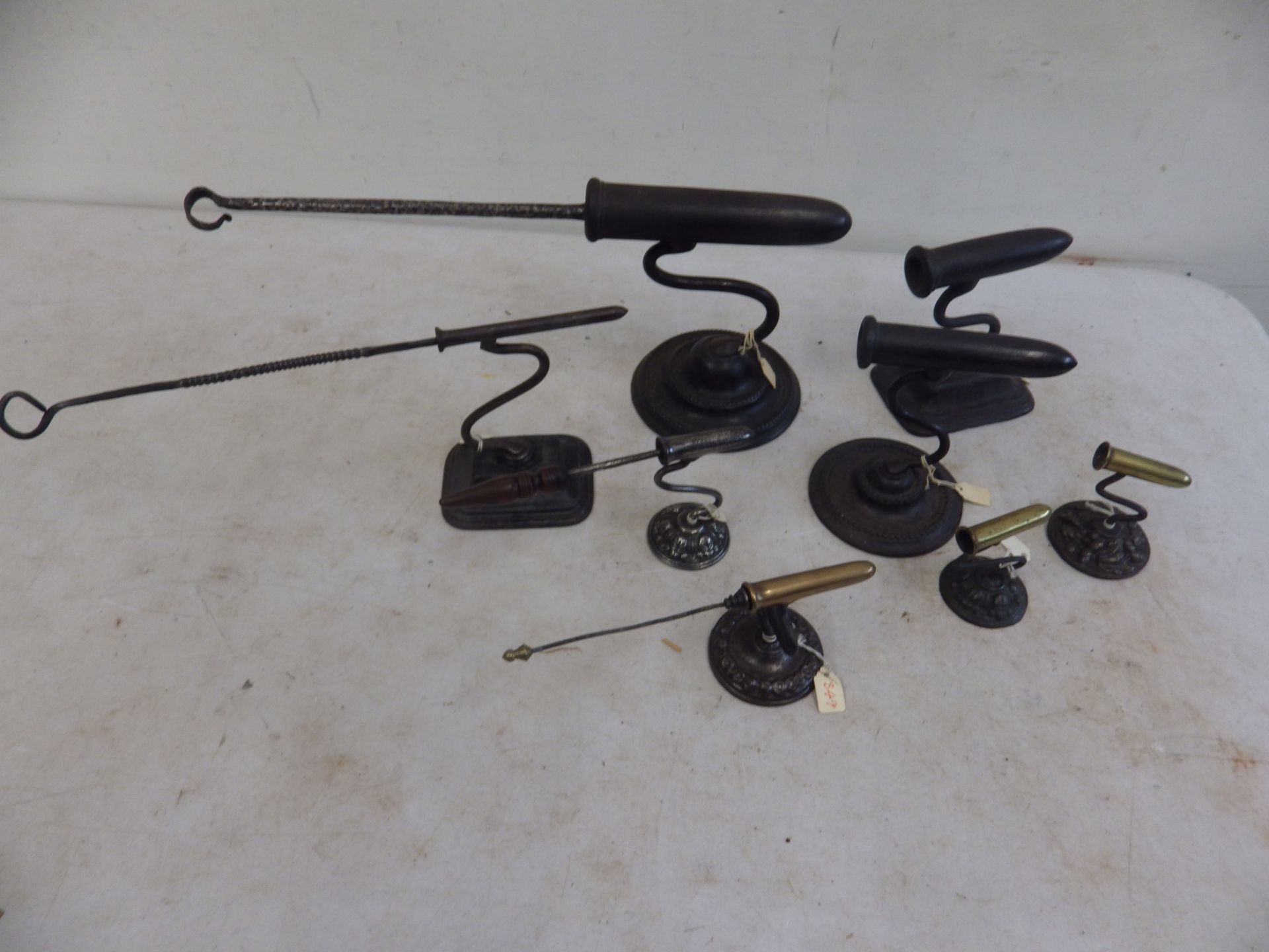 Assorted goffering, piping, Italian irons etc and stands including 3 with brass barrels, some with