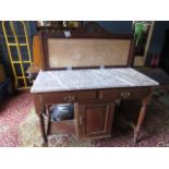 A washstand with marble top back has no tiles, one caster missing