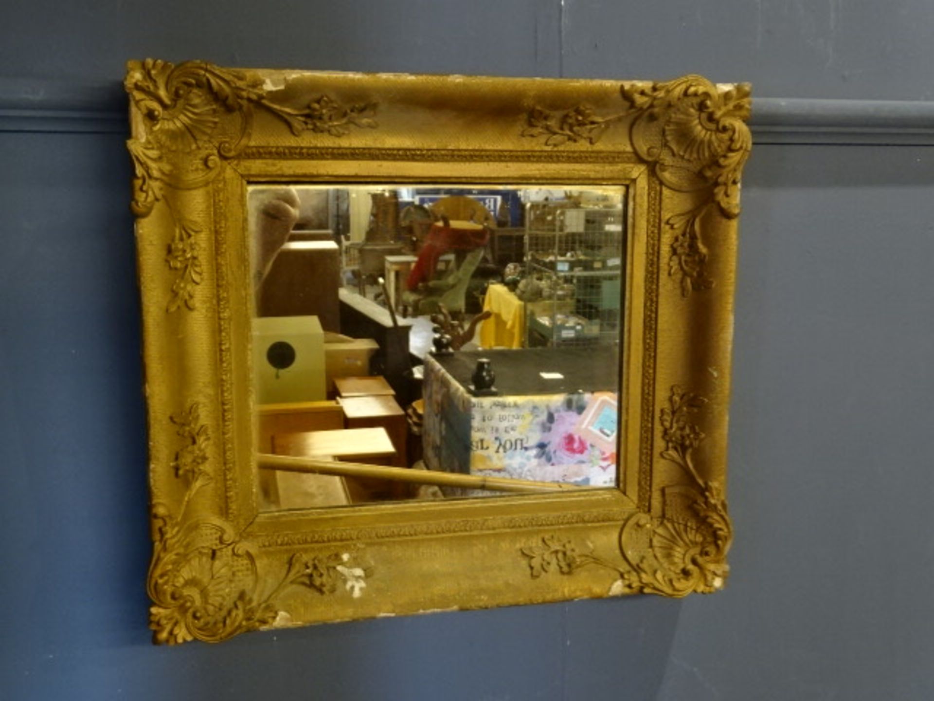 Ornate gilt framed wall mirror