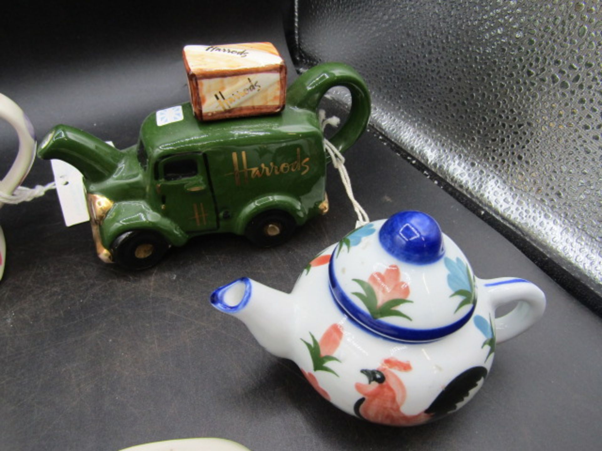 A collection of novelty teapots inc one enamelled and German priest cruet's - Image 5 of 7