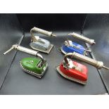 4 Metro enamel gas irons patent 360555 in red, blue, green and gray all with trivets