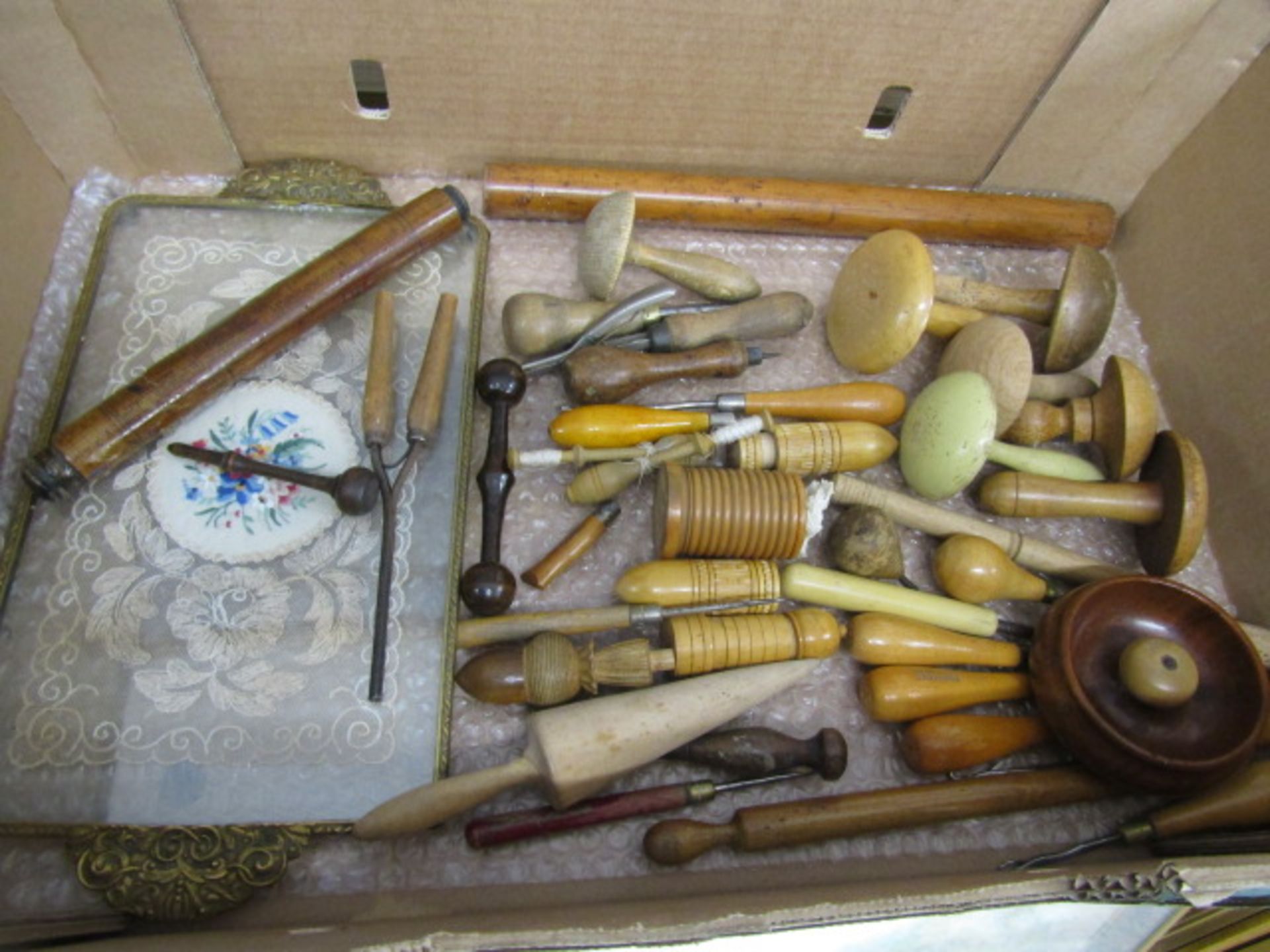 Darning mushrooms, rug looms and various sewing implements