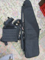 Sniper rifle carry bag with accessory pockets and shoulder straps  plus a tactical vest