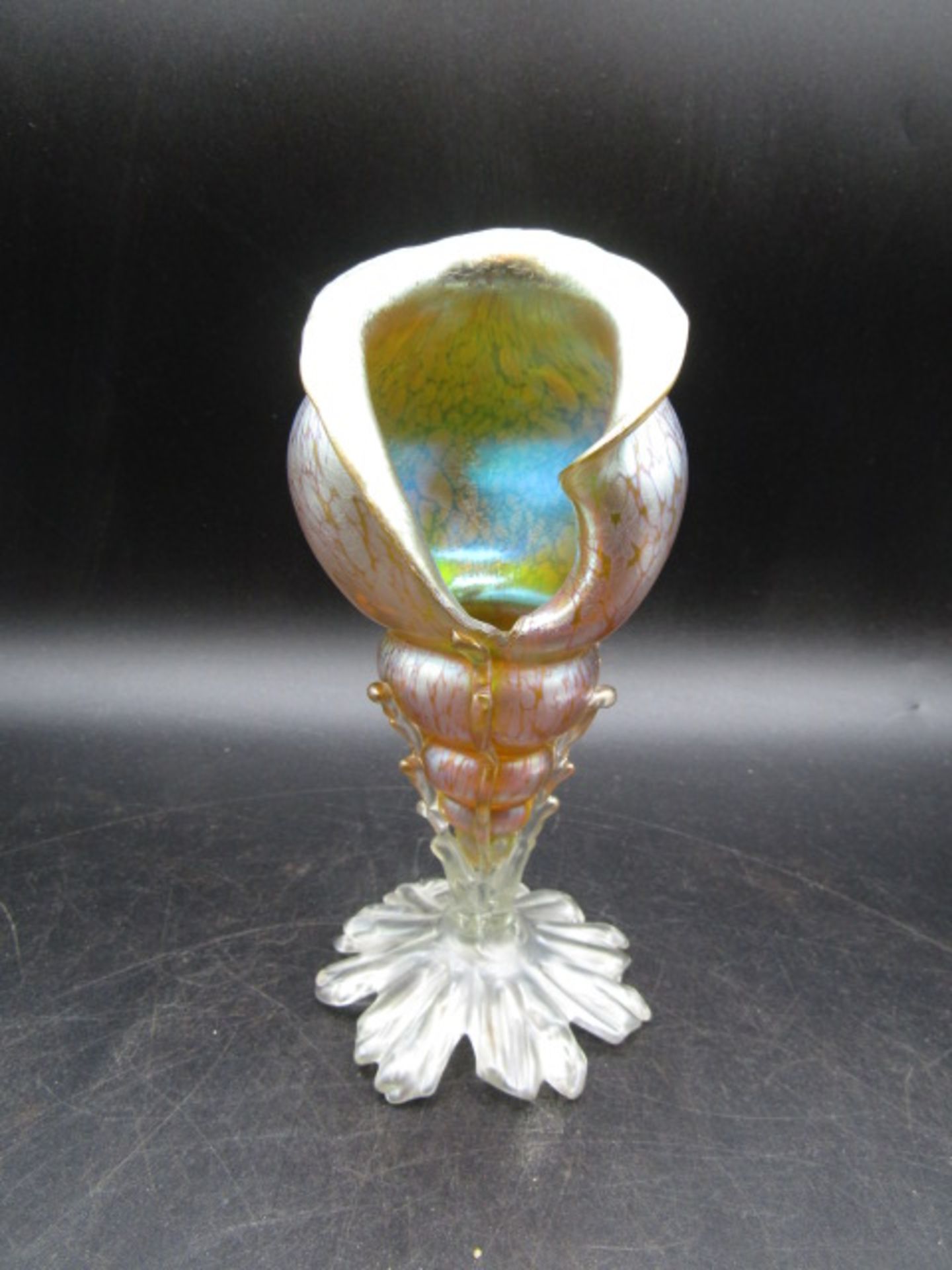 Loetz - An early 20th Century glass vase formed as a conch shell in the Creta Papillon pattern