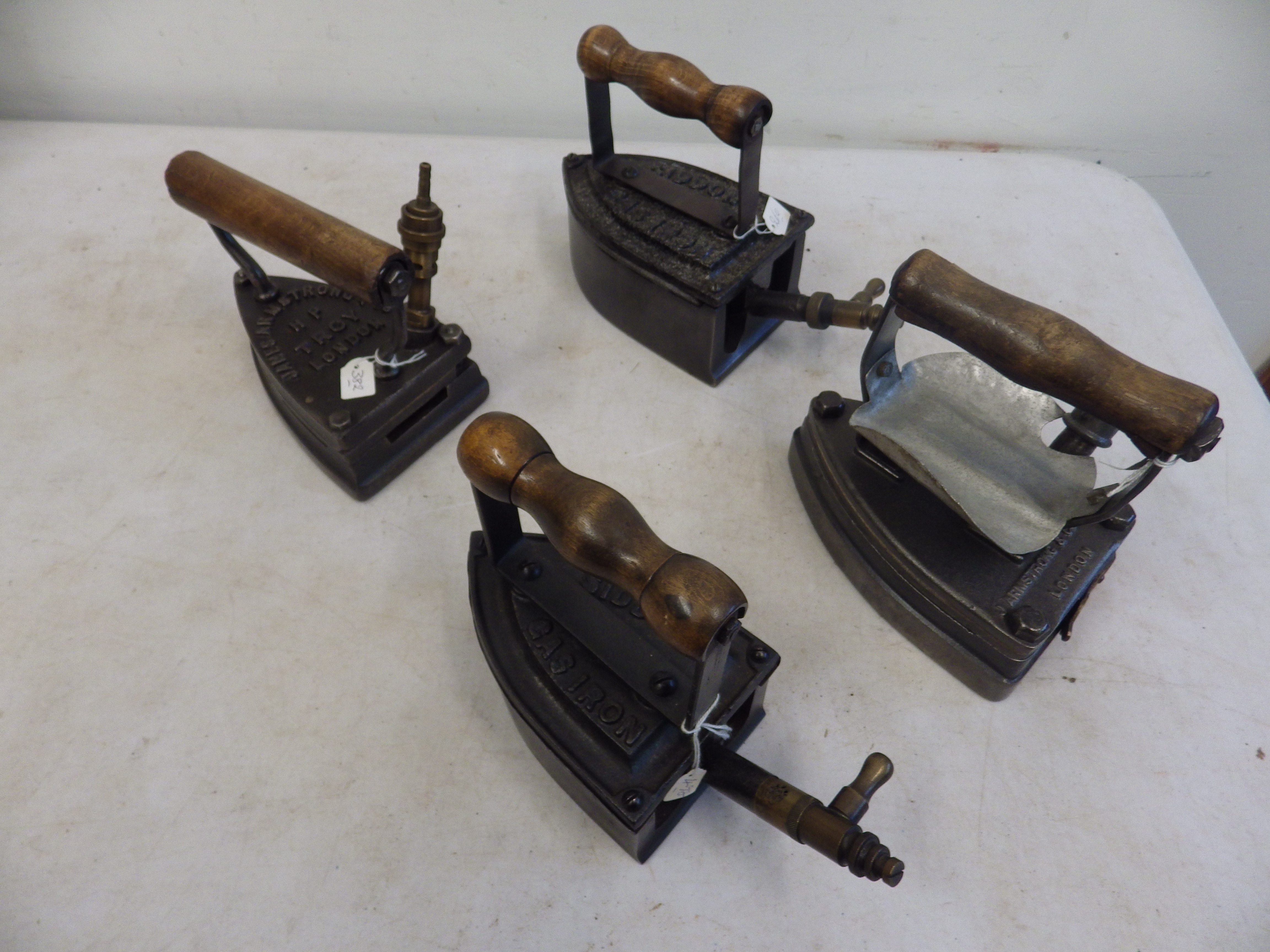 2 Siddons gas irons together with 2 James Armstrong & Co London gas irons to incl No.8 iron and