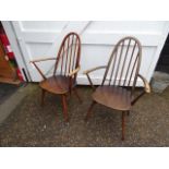 Pair of Ercol stick back armchairs