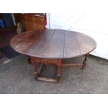 Large antique oak drop leaf dining table with drawer each end